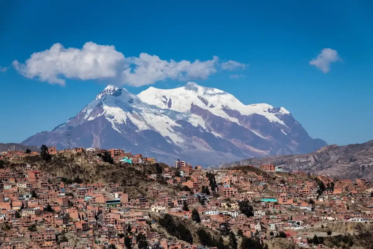 Best eSIM for Bolivia: snow-capped Illimani mountain towering over the cityscape of La Paz