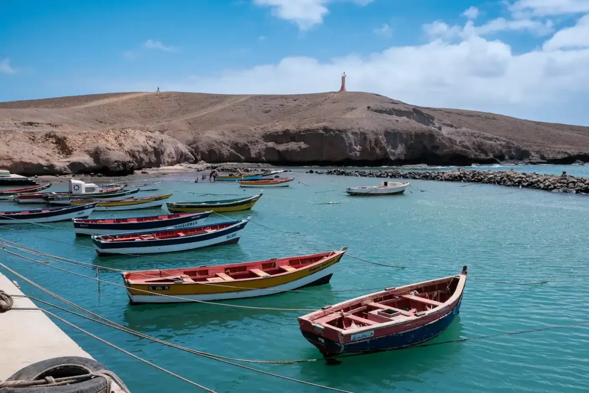 Best eSIM for Cape Verde: colorful fishing boats in the turquoise bay at Pedra Lume, Sal