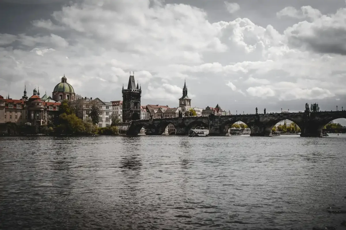 Best eSIM for Czech Republic: Charles Bridge over the Vltava River with Prague skyline at sunset