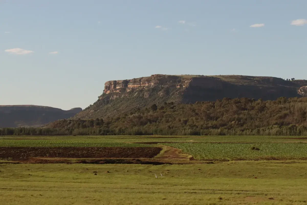 Best eSIM for Lesotho: rugged mountains and fields of the Mountain Kingdom under a clear sky